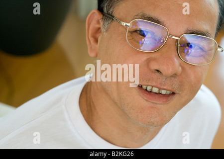 Portrait of a mature man wearing eyeglasses and smiling Stock Photo