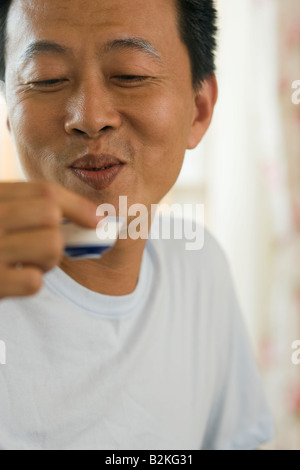 Close-up of a mature man drinking tea Stock Photo