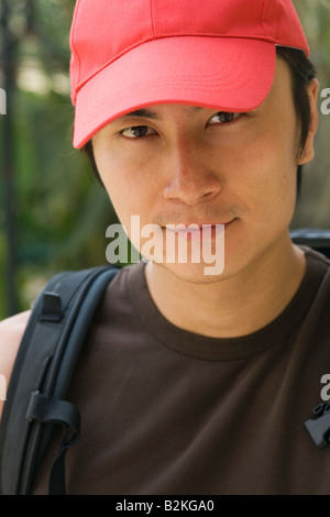 Portrait of a young man wearing a cap and smiling Stock Photo