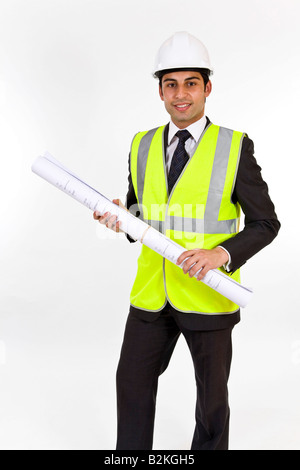 Architect - man in hard hat high visibility jacket and holding plans. Stock Photo