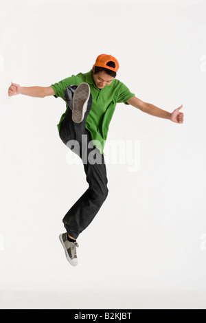 Young man kicking and jumping Stock Photo