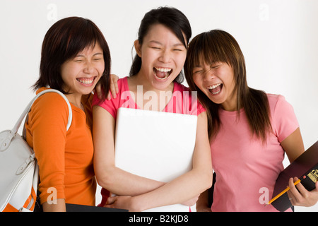Three female university students standing together Stock Photo