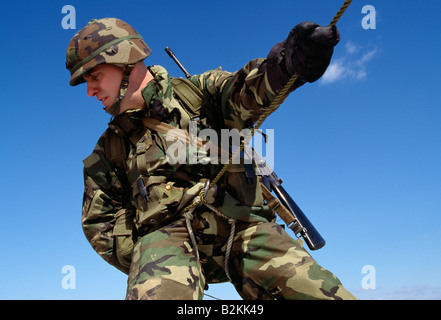 US Army soldier on maneuvers in the field Stock Photo