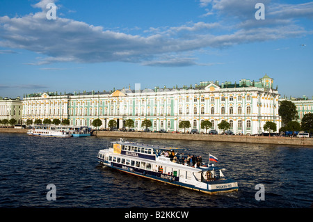 Boat tour passing the Winter Palace of the State Hermitage Museum on the River Neva, St Petersburg, Russia Stock Photo