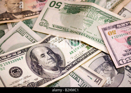 A pile of fifty and one hundred dollar bills Stock Photo