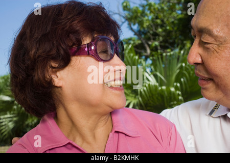 Close-up of a couple looking at each other and smiling Stock Photo