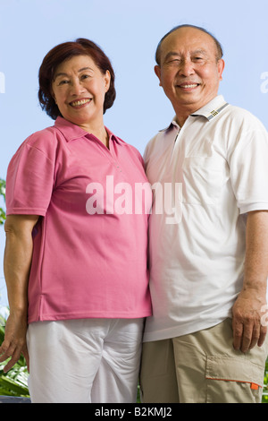 Portrait of a couple standing together and smiling Stock Photo