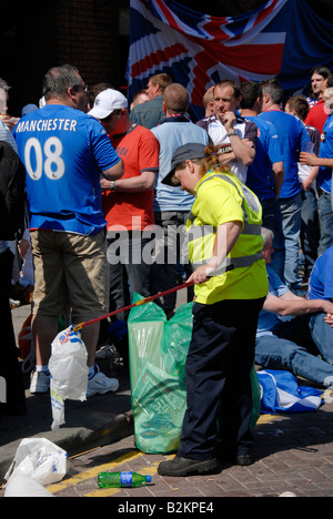 Collecting litter as glasgow rangers fans gather in manchester for the euro final 2008. Stock Photo