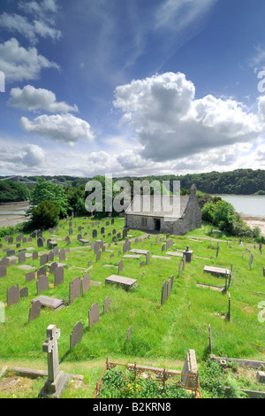 St Tysilio church on Church Island on Anglesey in North Wales looking across the Menai Strait to the Menai Bridge Stock Photo