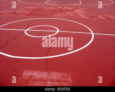 An empty basketball court with white painted lines Stock Photo