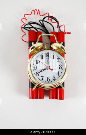 Alarm clock timer attached to sticks of dynamite Stock Photo