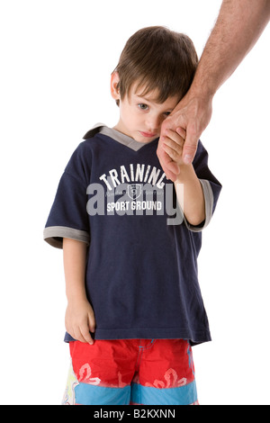 Adorable upset child hand with dad isolated on white background Stock Photo