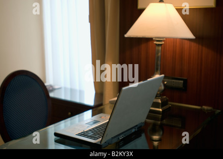 Notebook computer on table in hotel room, China, Nanjing, Lakeview Xuanwu Hotel Stock Photo