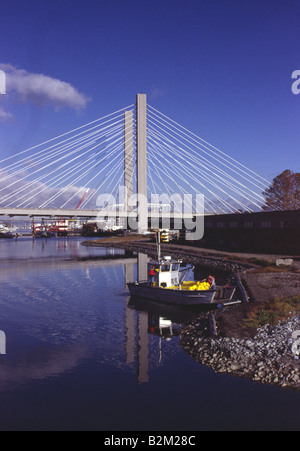 Water & Fish Management Crew in the Thea Foss Waterway under the Interchange Bridge Tacoma Washington Stock Photo