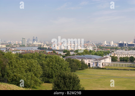 View from Observatory Hill, Greenwich Park towards the City of London and the Greenwich Wheel at the Royal Naval College Stock Photo