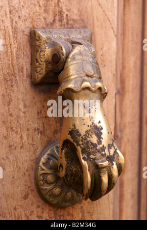 Antique door knocker on old Mexican front door Stock Photo