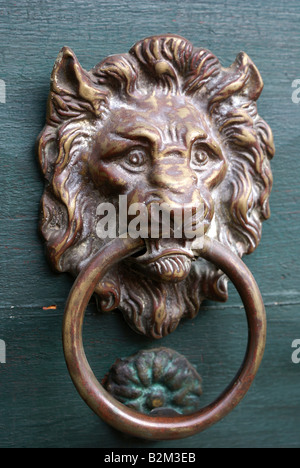 Antique door knocker on old Mexican front door Stock Photo
