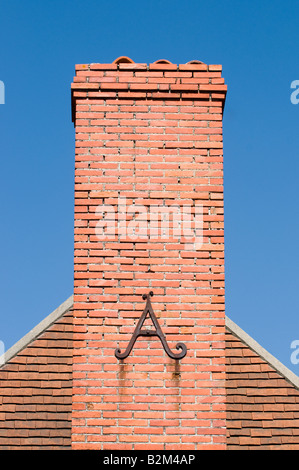 Decorative letter 'A' reinforcing chimney stack, France. Stock Photo