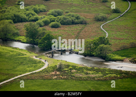 Bridge over a river from above, People walking on path, Derwent Water, Lake District, Cumbria, North England, UK Stock Photo