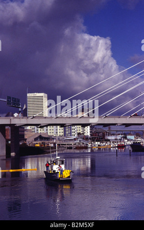 Water & Fish Management Crew in the Thea Foss Waterway under the Interchange Bridge Tacoma Washington Stock Photo