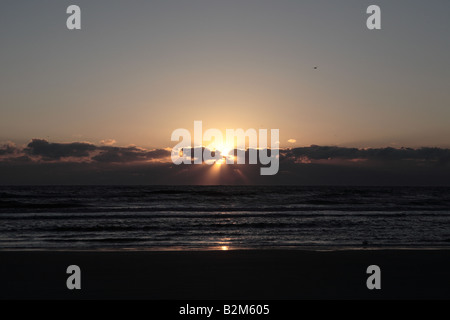 SUN RISING OVER ATLANTIC OCEAN ON THE BEACH ON CUMBERLAND ISLAND NATIONAL SEASHORE GEORGIA USA Stock Photo