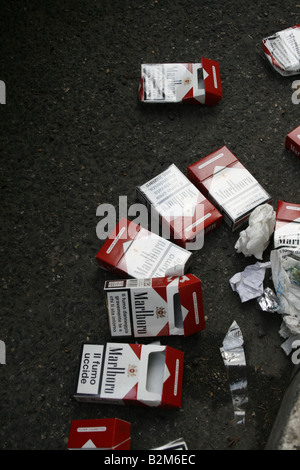 lots of cigarette packs left on street road Stock Photo