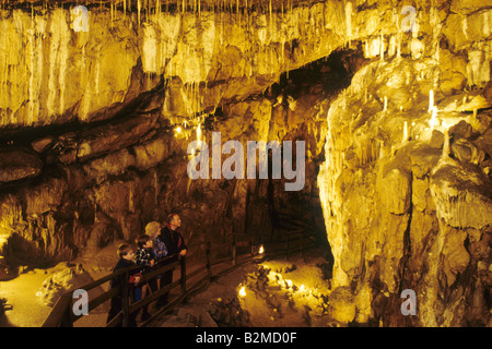 Poole's Cavern Buxton Derbyshire people visitors cave interior stalactites England UK Stock Photo