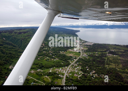 Flight seeing in a small airplane plane over the coast of Cook Inlet near Homer, Alaska, United States of America Stock Photo