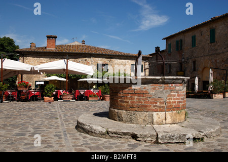 the towns water well in piazza roma monteriggioni tuscany italy europe Stock Photo