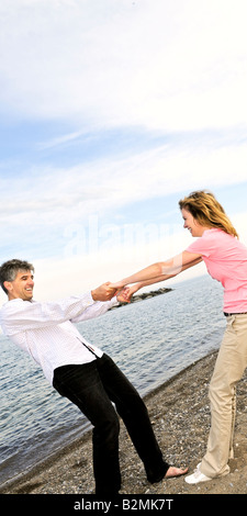 Mature romantic couple having fun on a beach Stock Photo