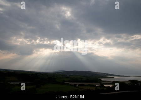 The sun breaks through the clouds over the village of Gortahork in Donegal, Ireland. Stock Photo