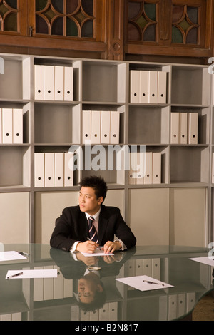 Businessman sitting in an office Stock Photo