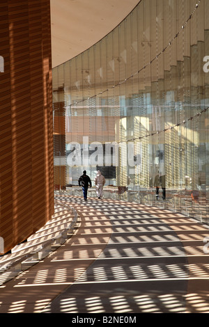 Two people walking away down walkway outside Carl Icahn Laboratory at Princeton University. Stock Photo
