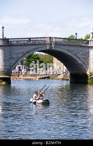 Couple enjoy a boat ride by Richmond Bridge Richmond TW10 Surrey United Kingdom Stock Photo
