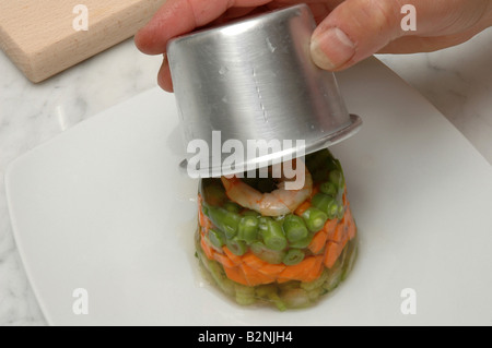 Aspic with vegetables, tunny and shrimps Stock Photo