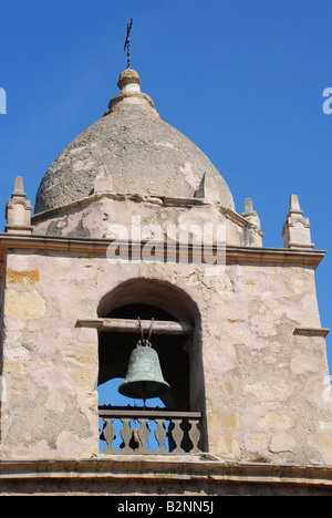 Architecture detail of the bell tower showing one of the nine bells in the  tower at the Basillica Carmel Mission Stock Photo