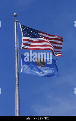 FLAG OF THE UNITED STATES OF AMERICA FLYING OVER OKLAHOMA STATE FLAG Stock Photo