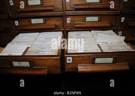 Oak card catalogs in Glasgow's Mitchell Library have handwritten entries for items that entered the collection a century ago. Stock Photo
