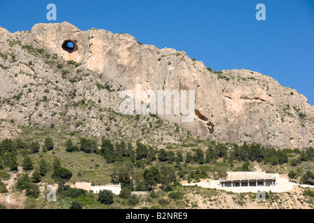 Unusual circular hole in limestone mountain Canelobre near Alicante Spain Stock Photo