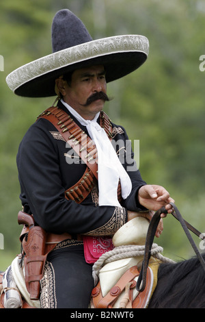 A Mexican cowboy on horseback Stock Photo