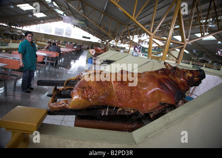 Whole roast pig in the central market in the small town of Gualceo, outside of Cuenca, Ecuador. Stock Photo