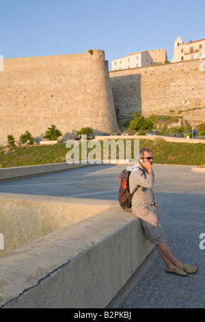 Male tourist on mobile phone Stock Photo