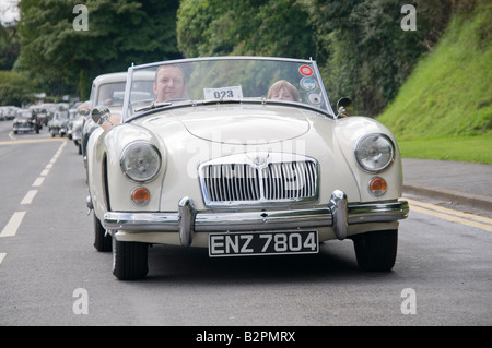 MGA sports car at the head of a row of classic and vintage cars. Stock Photo