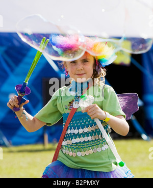 Child with bubble machine at The Big Chill Festival 2008, Eastnor Castle, Herefordshire Stock Photo