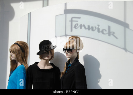 Three female mannequins in on display in Fenwick department store window New Bond Street London England Stock Photo