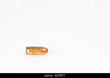A bullet on a white background.  A speeding bullet representation. Stock Photo