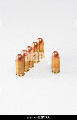 Bullets lined up at attention on a white background Stock Photo