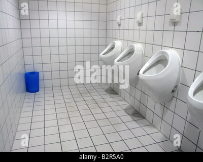 Urinals In The Men's Bathroom With White Ceramic Urinals Design Of White Men  In The Toilet. Stock Photo, Picture and Royalty Free Image. Image 54213166.