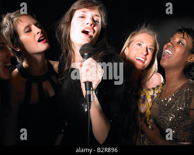 Group of women singing,karaoke Stock Photo