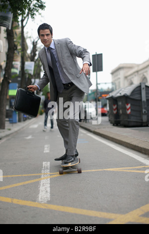 Business man on skateboard Stock Photo